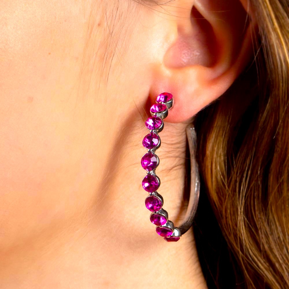 Silver hoop earrings with pink stones